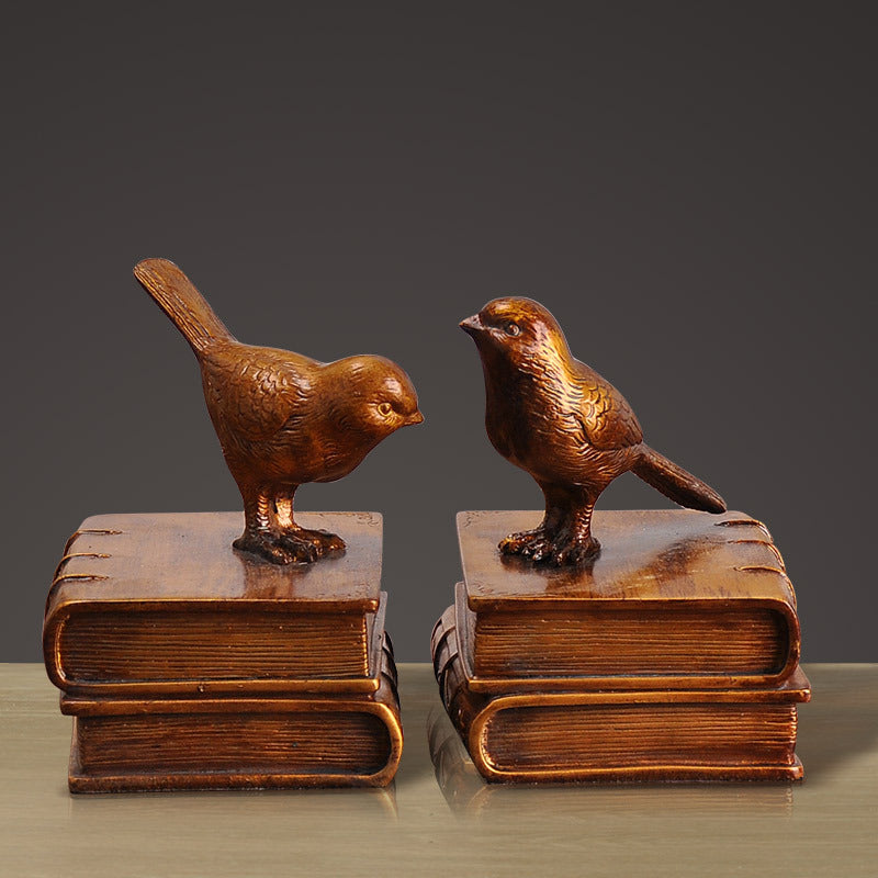Dekorative Buchstützen mit Vogel-Figuren