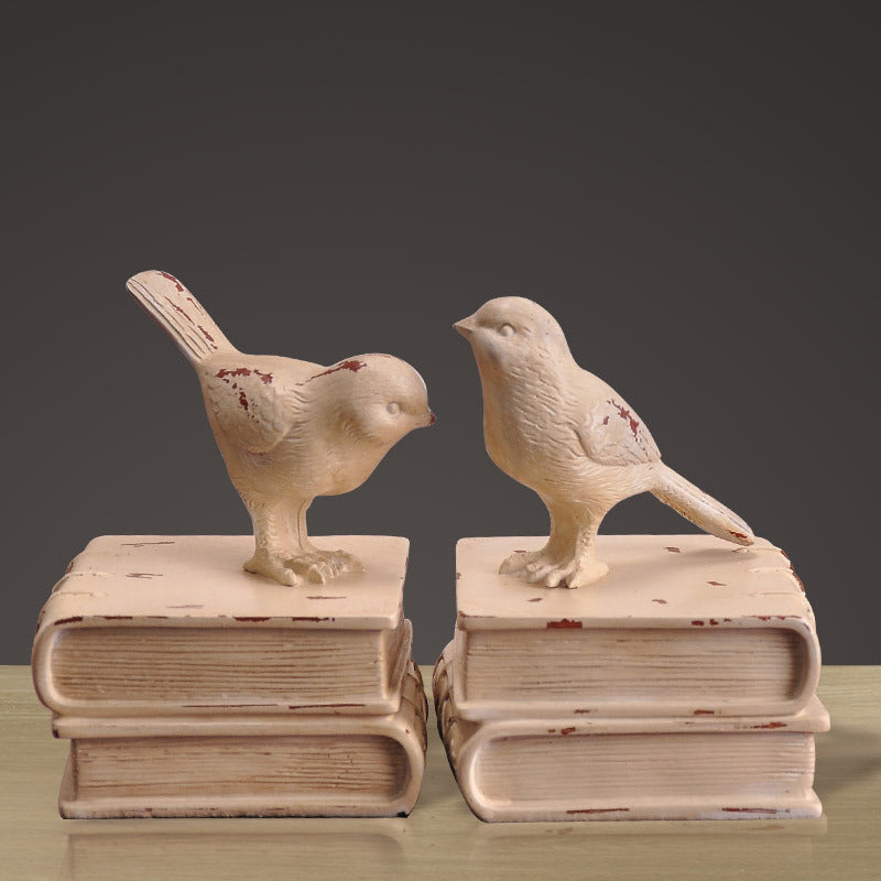 Dekorative Buchstützen mit Vogel-Figuren