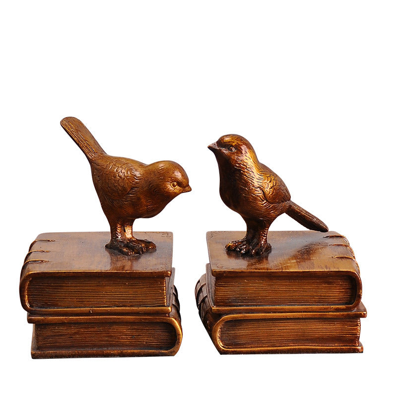 Dekorative Buchstützen mit Vogel-Figuren