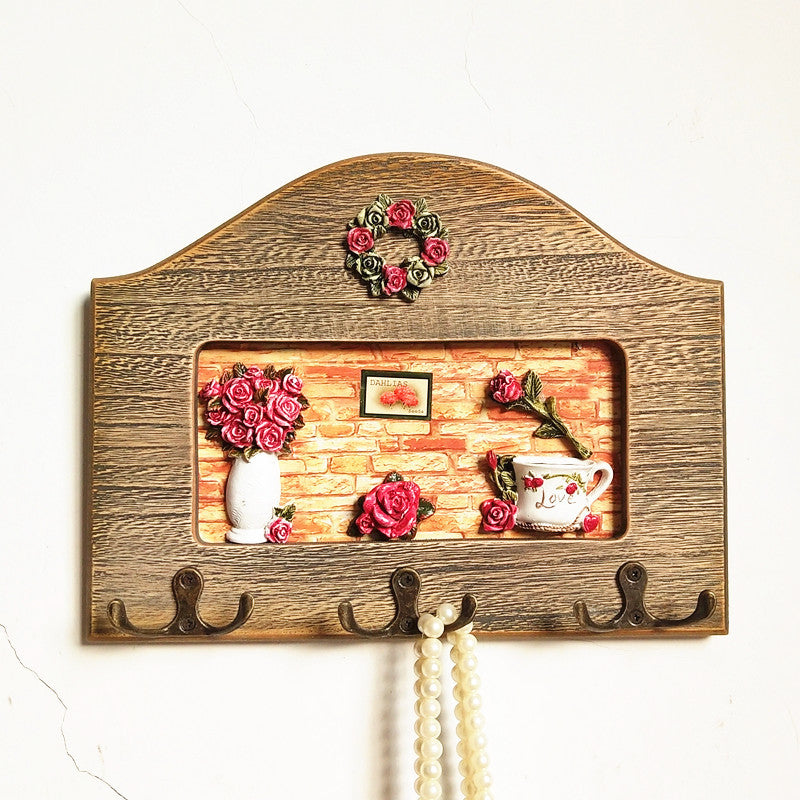 Dekorativer floral Wandhakenregal