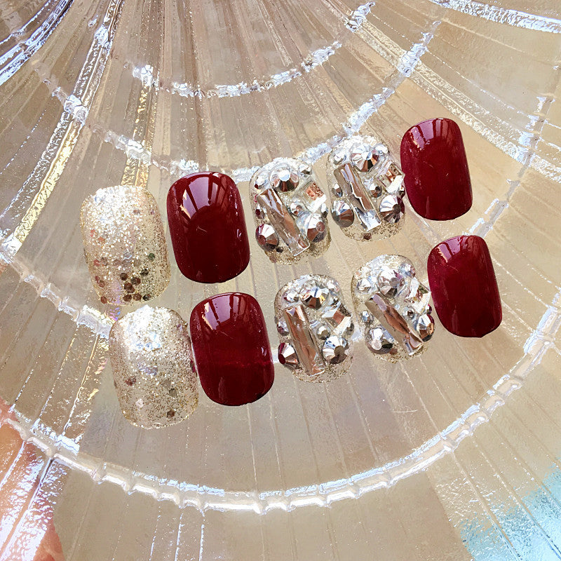 Kunstnägel mit luxuriöser Glitter- und Blumendesign Brehn