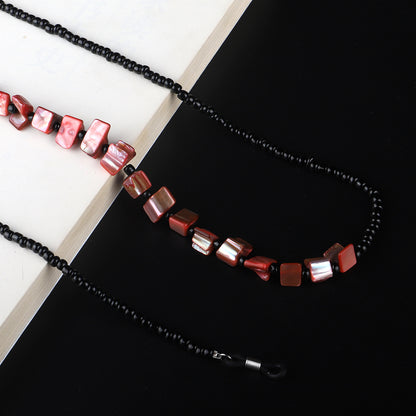 Perlenbrillenhalter mit natürlichen Muschelakzenten Brehn