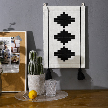 Gewebter Wandbehang mit grafischem Ethno‑Relief und Quasten Brehn
