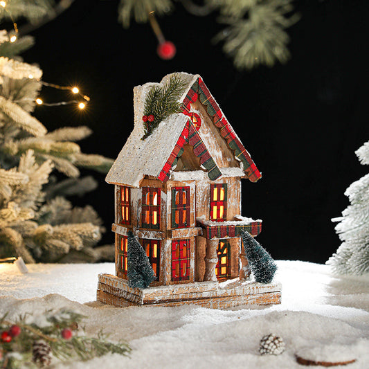 Beleuchtetes Holz-Weihnachtshaus im europäischen Retro-Stil