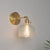 Eisen Messing-Finish Wandleseleuchte Schwenkarm 1-Licht Industrielle Wandlampe mit Blüte/Schale Klarglas-Schirm | Brehn