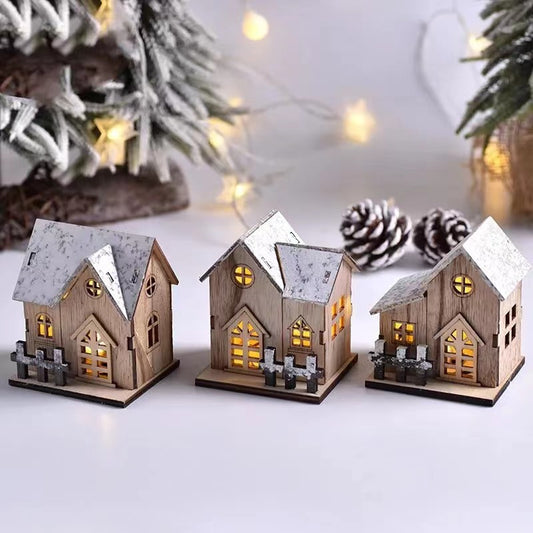 Beleuchtetes Holzhaus für weihnachtliche Tischdekoration