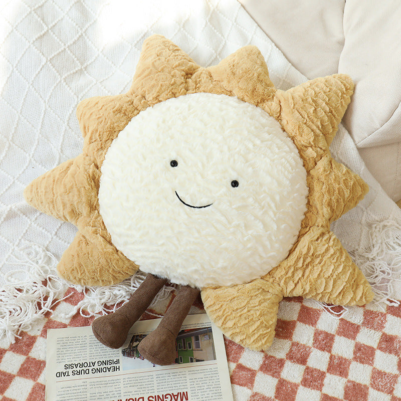 Dekorative Kuschelkissen mit Mond-, Stern- und Sonnenmotiv