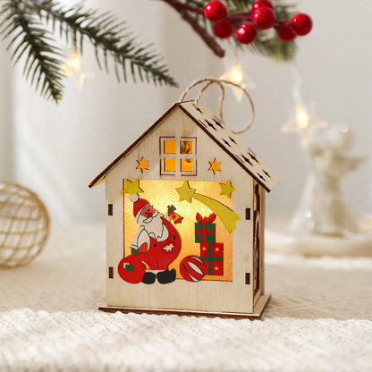Beleuchtetes Holzhaus als Weihnachtsdekoration