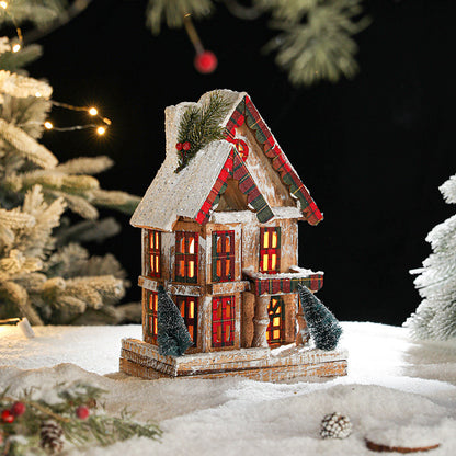 Beleuchtetes Holz-Schneehaus im Retro-Stil
