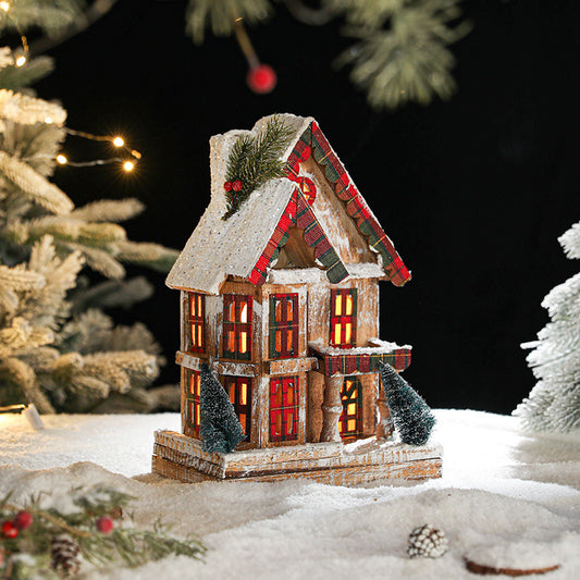 Beleuchtetes Holz-Schneehaus im Retro-Stil