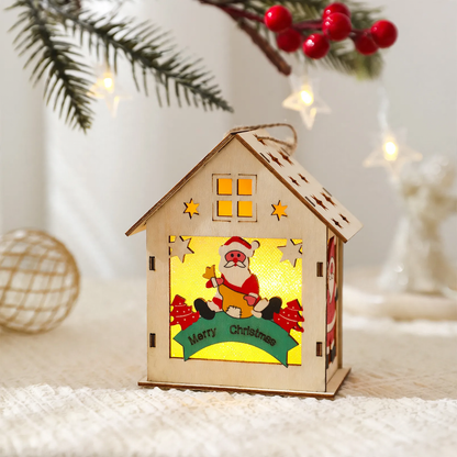 Beleuchtetes Holzhaus als Weihnachtsdekoration