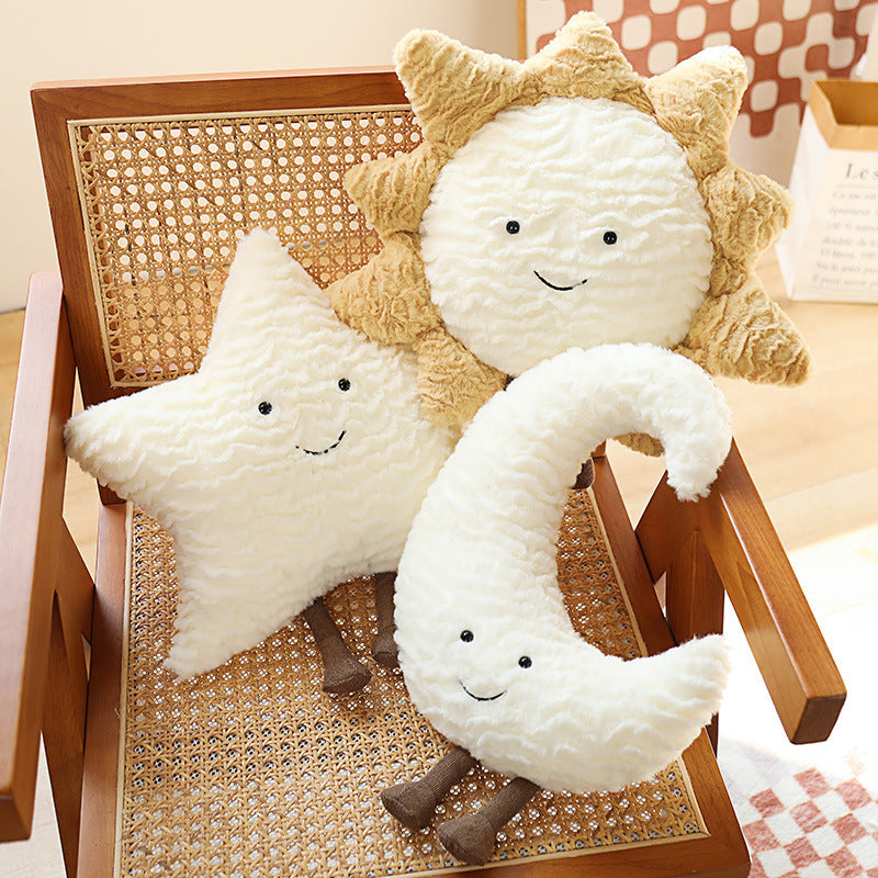 Dekorative Kuschelkissen mit Mond-, Stern- und Sonnenmotiv