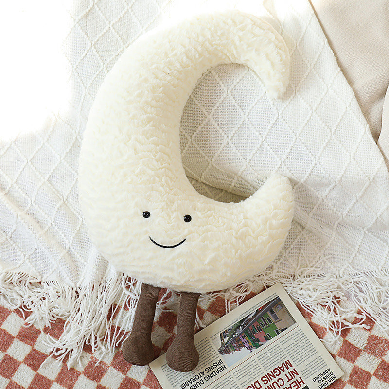 Dekorative Kuschelkissen mit Mond-, Stern- und Sonnenmotiv