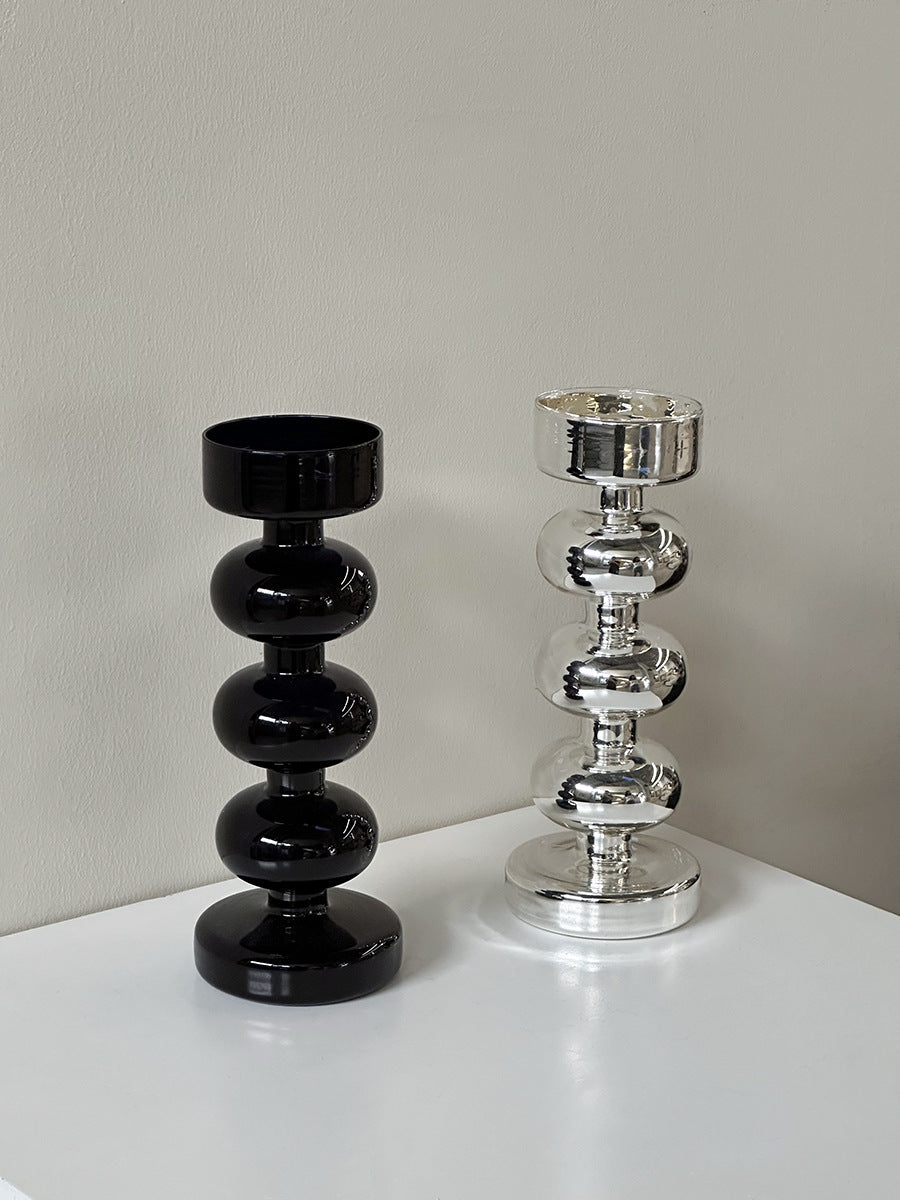 Dekorativer Kerzenhalter aus Glas und Holz