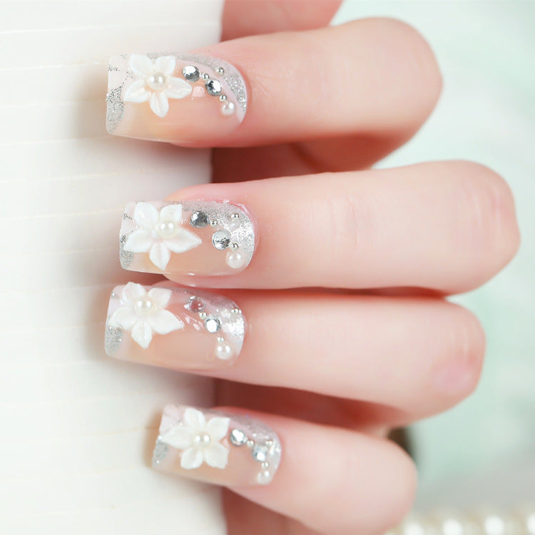 Florales Design Press-On Nail Set mit Strass-Akzenten