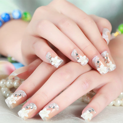 Florales Design Press-On Nail Set mit Strass-Akzenten