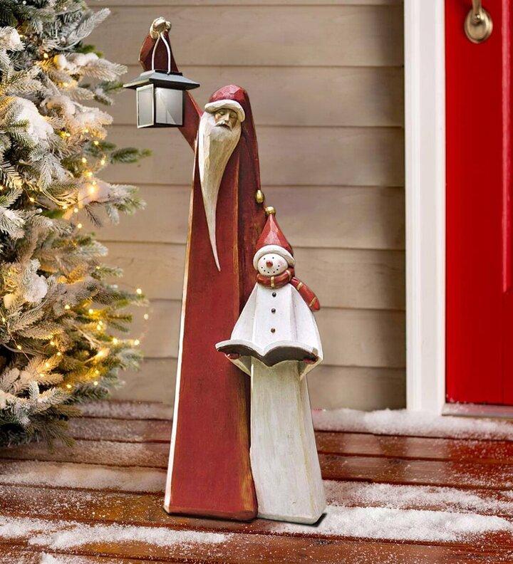 Weihnachtsmann- und Schneemann-Skulptur