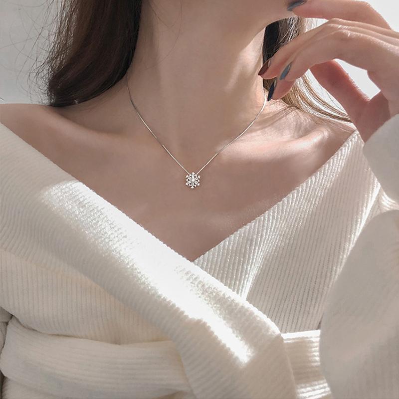 Glänzende Schneeflocke Kette