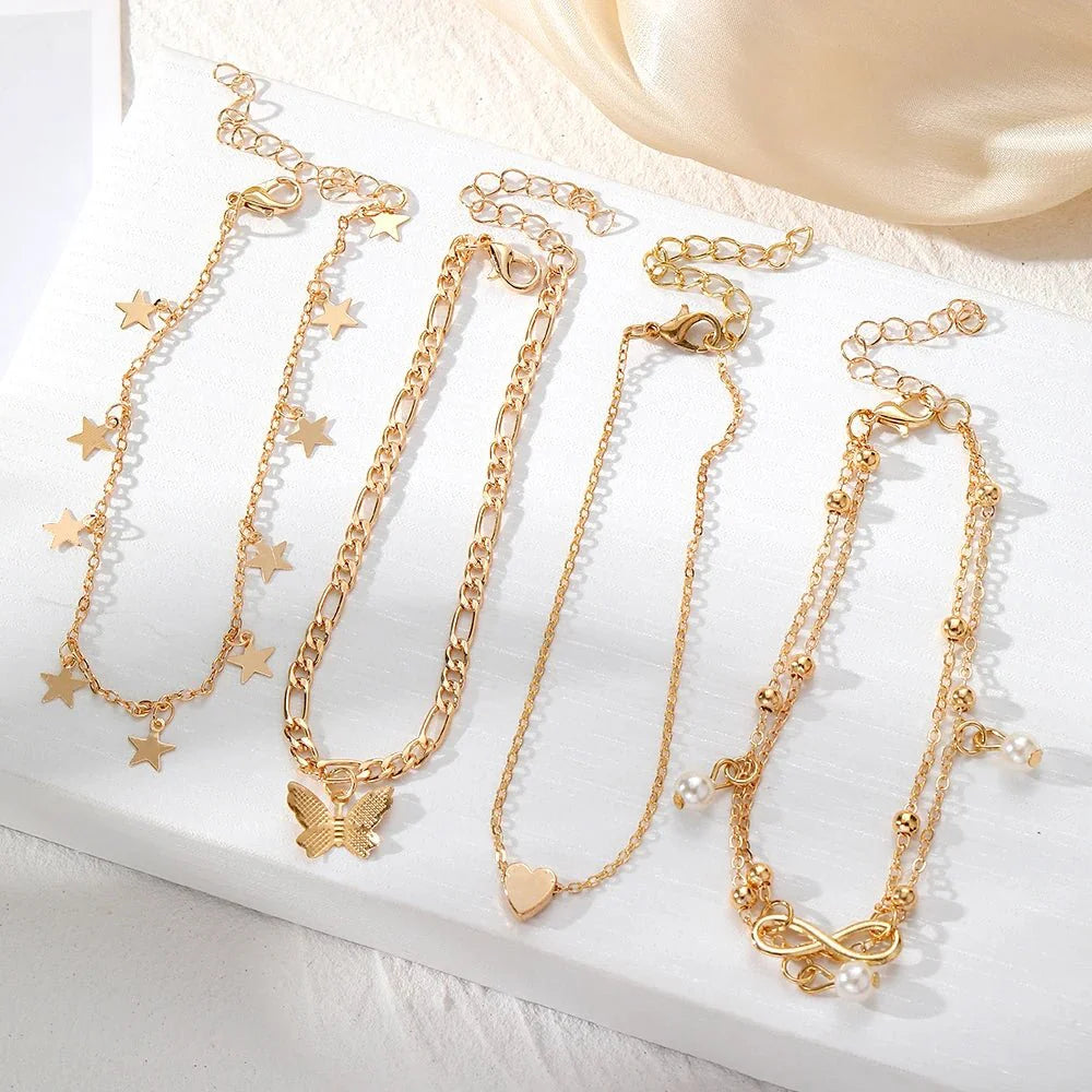 Brehn | 5-teiliges zierliches feminines Fußkettchen-Set (Sterne, Herz, Schmetterling, Unendlichkeit, Perlen)