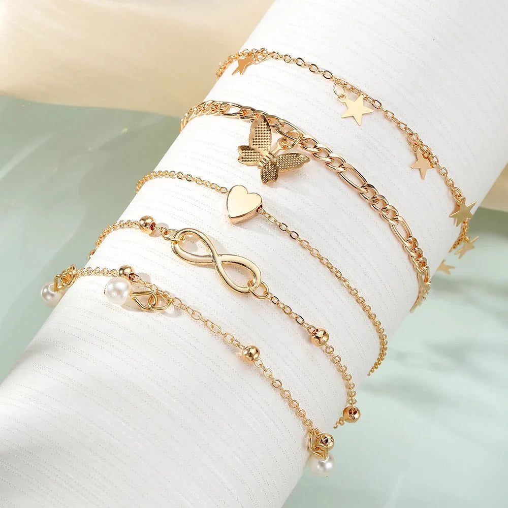 Brehn | 5-teiliges zierliches feminines Fußkettchen-Set (Sterne, Herz, Schmetterling, Unendlichkeit, Perlen)