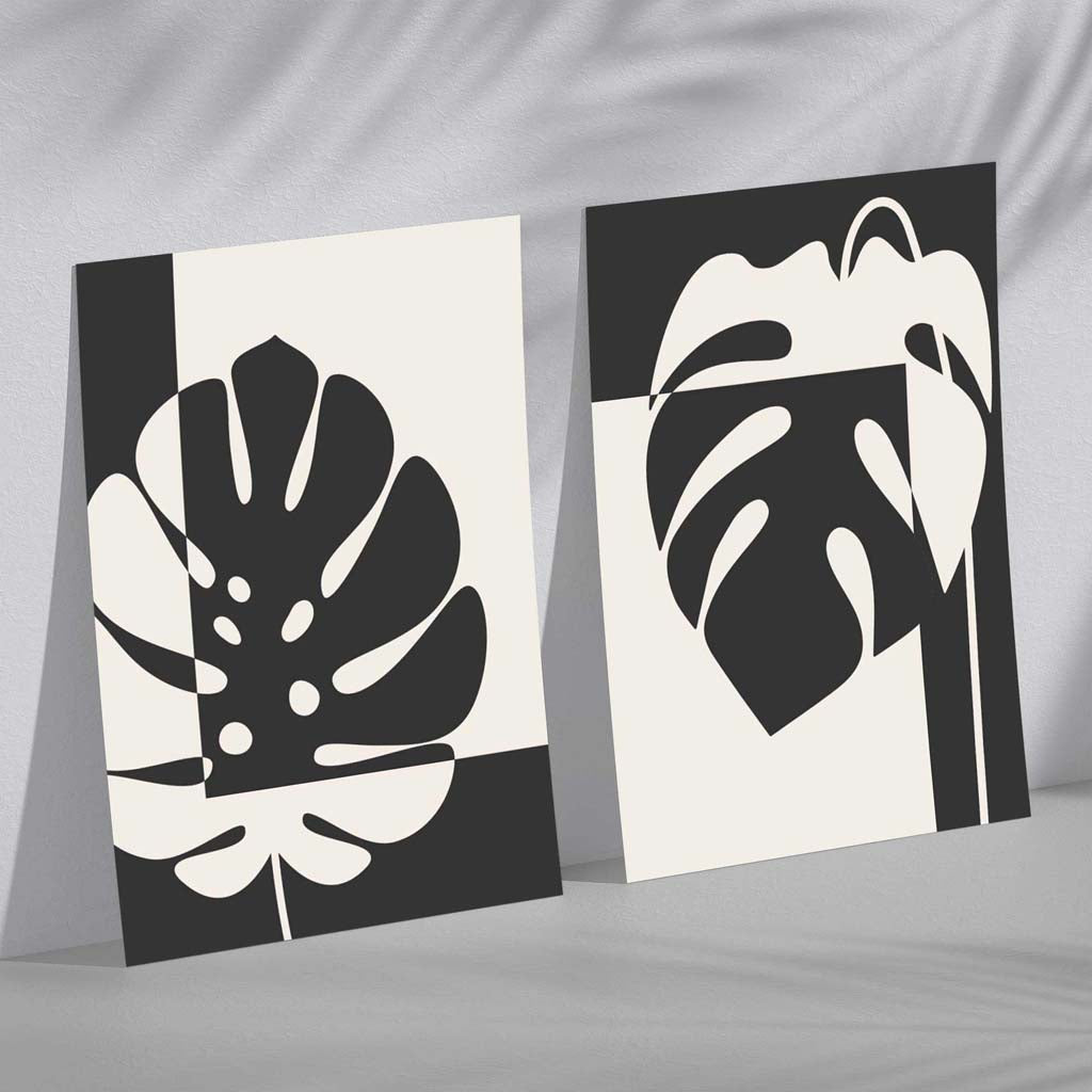 Set aus 2 gerahmten Kunstdrucken mit Monstera-Motiven in Schwarz und Beige
