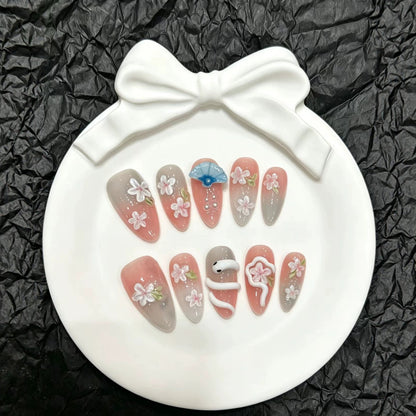 Dekoratives Druck-On-Nail-Art-Set mit floralen und Regenschirm-Akzenten