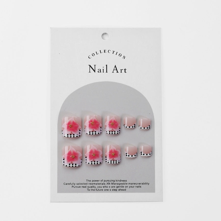 Kunstnagelset mit eleganten Blüten- und Punkte-Design Brehn
