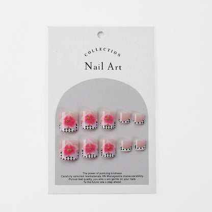 Kunstnagelset mit eleganten Blüten- und Punkte-Design Brehn