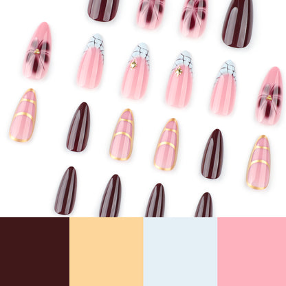 Kunstvolle Stiletto-Nägel mit Goldakzenten und dekorativen Blumenmotiven Brehn