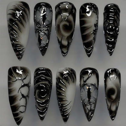 Kunstnagelset mit modernem Spiralmuster und glänzenden Akzenten Brehn