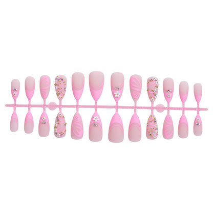 Kunstnagelset mit eleganten Blüten- und Glitzerverzierungen Brehn