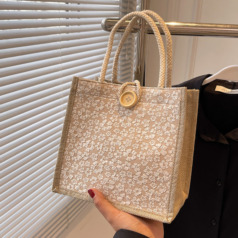 Elegante floral gemusterte Handtasche