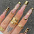 Künstlerisches langes Nagelspitzen-Set mit goldenen Akzenten Brehn
