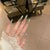 Elegantes Stiletto Press-On Nail Art Set mit Juwelenakzenten Brehn