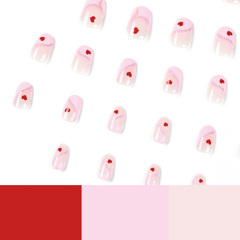 Kunstvolle Nagelverlängerungen mit Herzen-Motiv Brehn