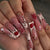 Dekorative Lange Press-On Nagelkunst mit Edelsteinakzenten Brehn