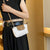 Kompakte Crossbody-Handtasche Brehn
