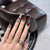 Dekoratives Press-On-Nagelkunst-Set mit schicker metallischer Akzentuierung Brehn