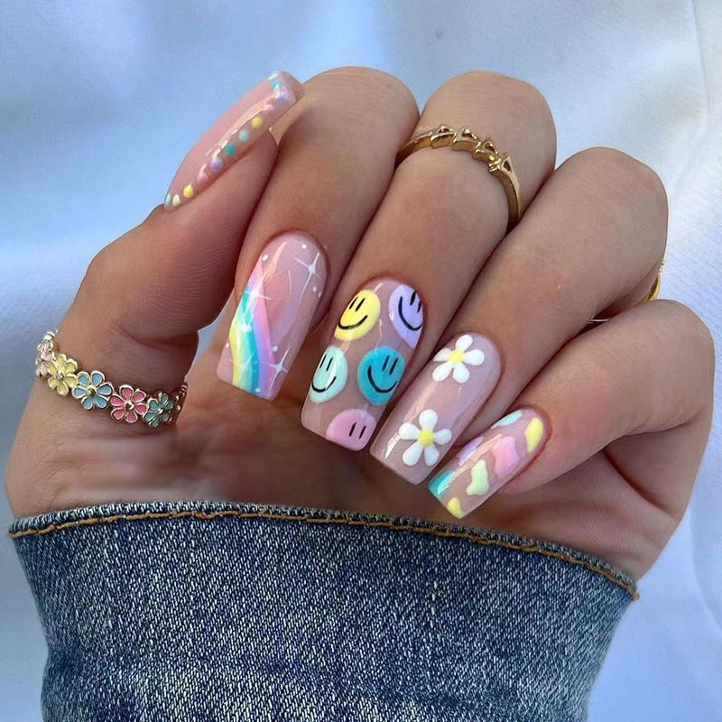Kunstvolle Nagelkunst mit Blumen- und Smiley-Motiven Brehn