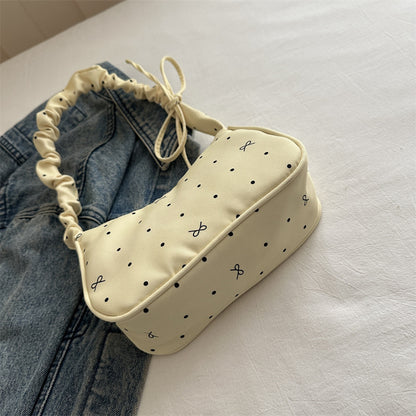Süßes, mit Schleifen verziertes Mini-Handtasche