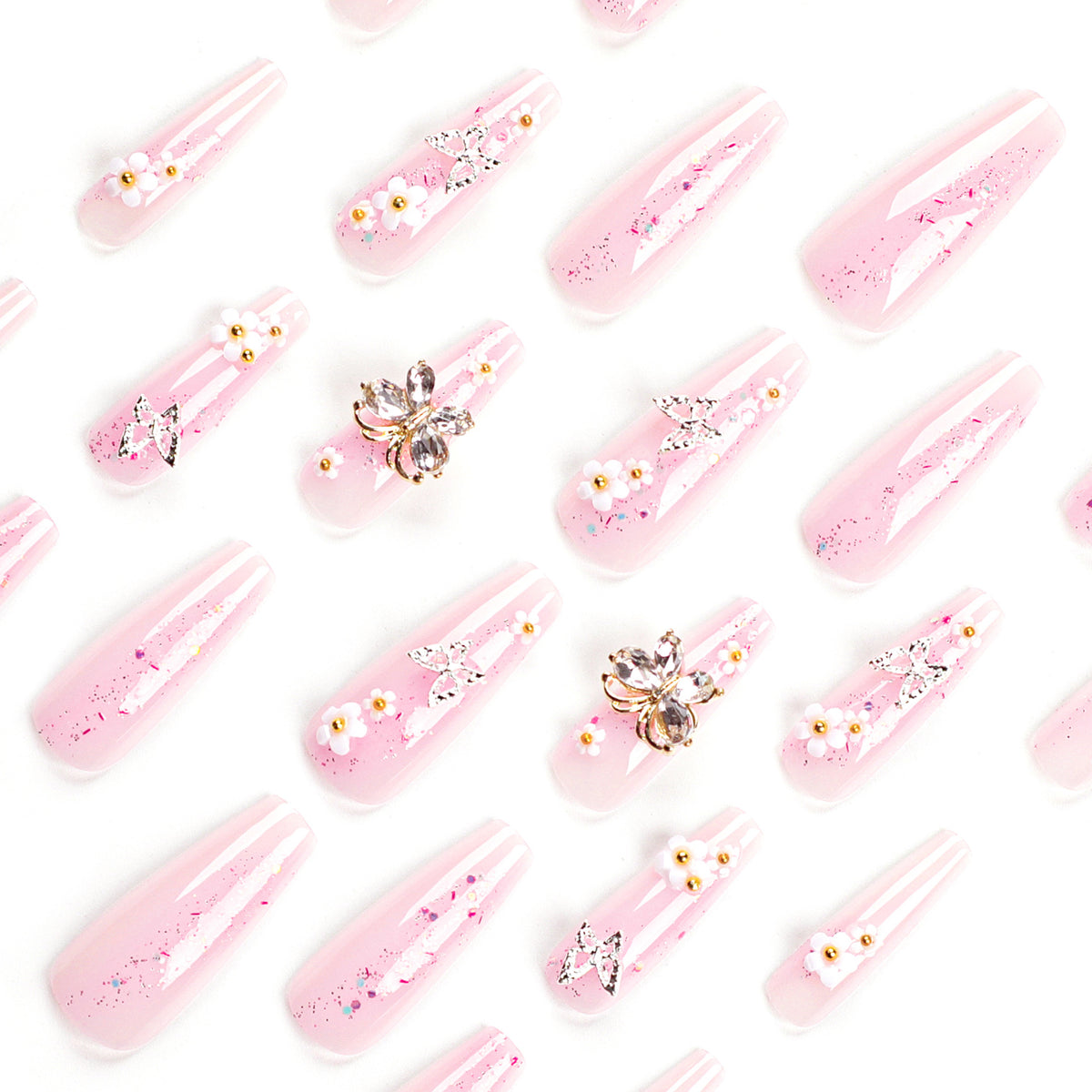 Kunstvolle Nagelverlängerungen mit Glitzer und floralen Akzenten Brehn
