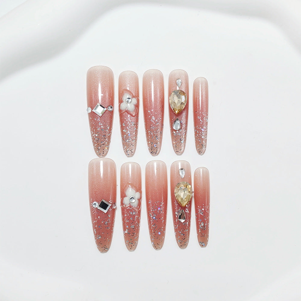 Glänzende Kunstnägel mit Strass und Glitter Brehn