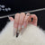 Künstlerisches Stiletto Press-On Nagelset mit dekorativen Rauten Brehn