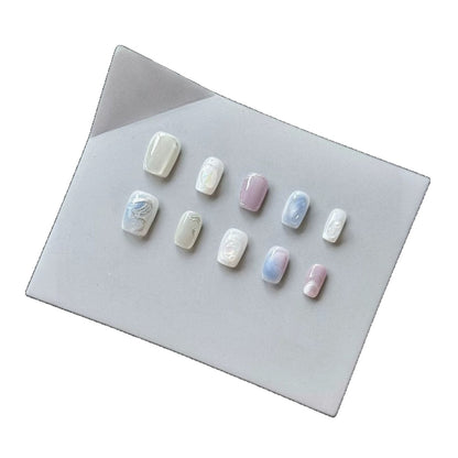 Künstlerisches Press-On Nagelset mit perlmuttartigen und marmorierten Designs