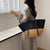 Damen Elegante Handtasche aus geflochtenem Naturmaterial mit luxuriösen Ledergriffen Brehn