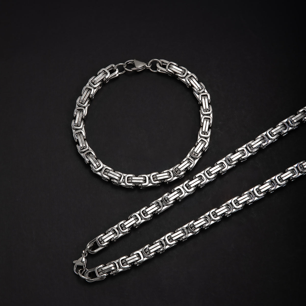 Elegantes ineinandergreifendes Kettenhalsketten- und Armbandset Brehn