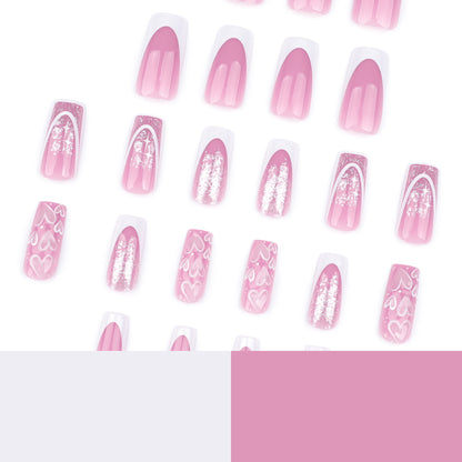 Kunstvolle Nagelverlängerungen mit modernem Glitzer-Design und Herzakzenten Brehn