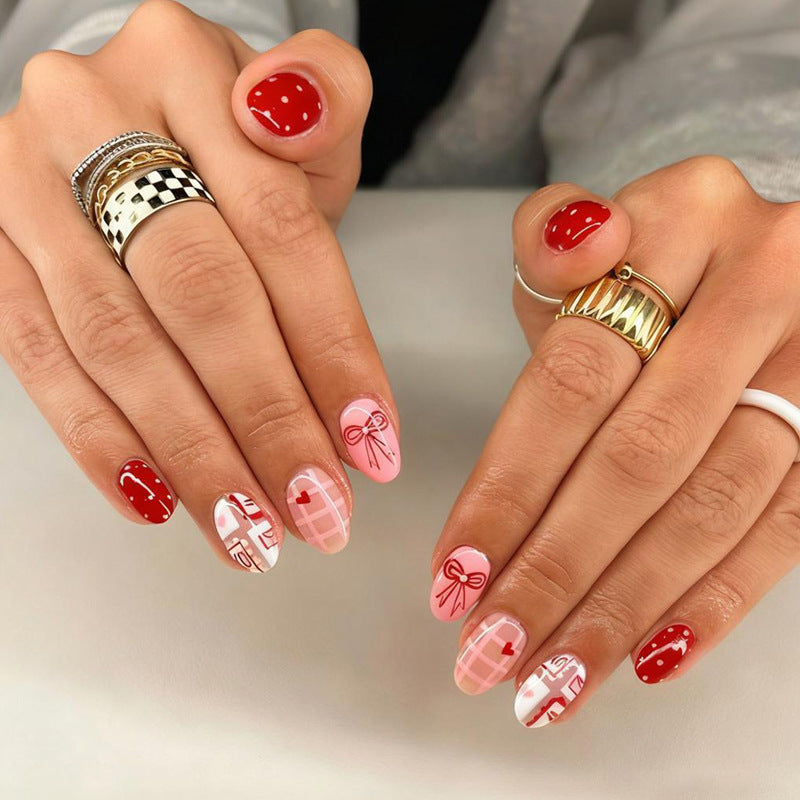Kunstnagelset mit bezaubernden Herz- und Schleifenmustern Brehn
