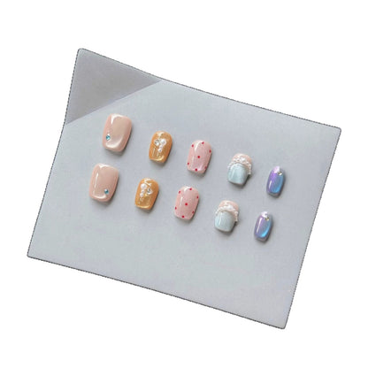 Dekoratives Press-On-Nagelkunst-Set mit einzigartigen Edelstein- und Perlenakzenten