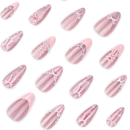 Kunstvolle Nagelverlängerungen mit zarten Schleifenmotiven Brehn